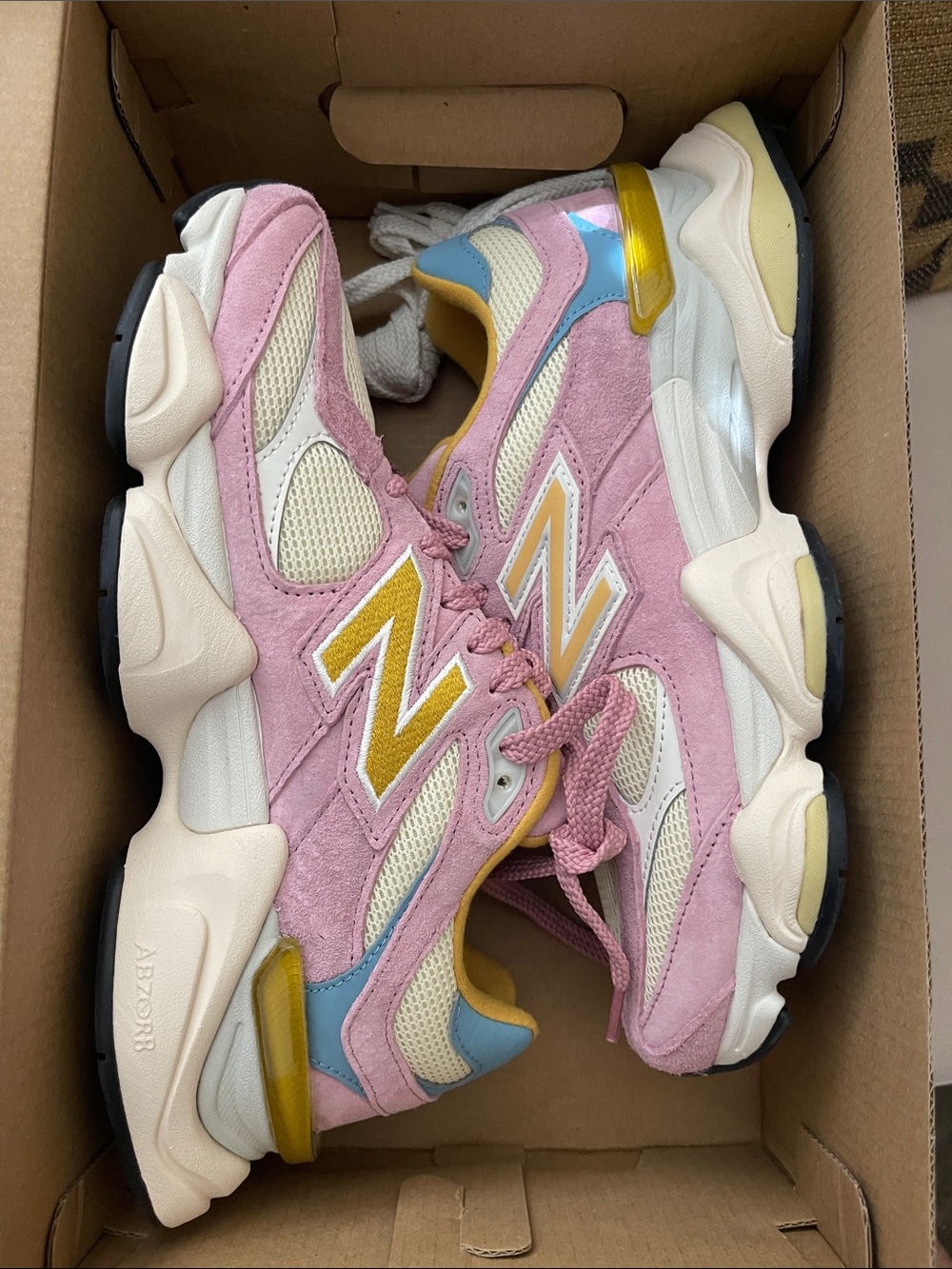 New Balance 9060 Women's Pink Suede & Mesh Sneakers with Yellow and Blue Accents